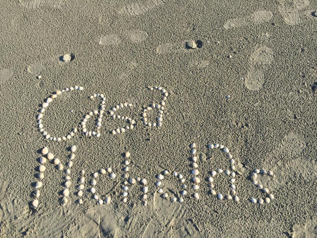 a word written in the sand on the beach at Casa LARA in Constanţa