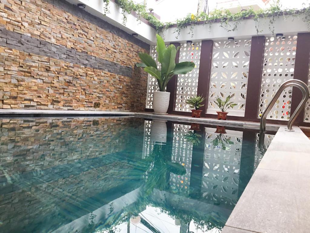 Bazén v ubytování Homestay May Trang nebo v jeho okolí