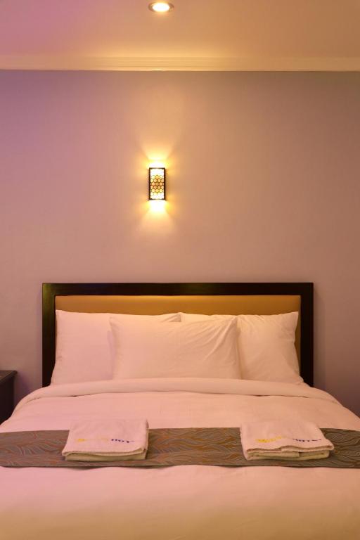 Postel nebo postele na pokoji v ubytování MAISON HOTEL