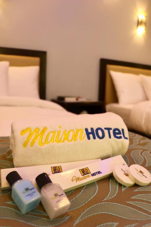 Postel nebo postele na pokoji v ubytování MAISON HOTEL