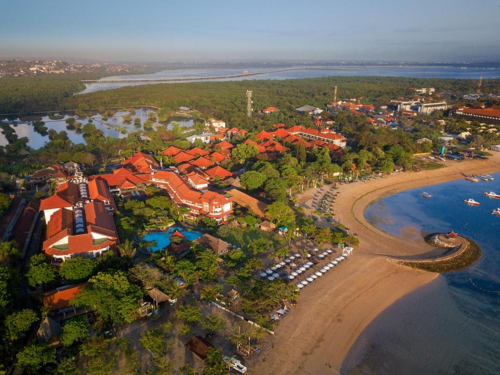 an aerial view of a resort on the beach at SOL by Meliá Benoa Bali All inclusive in Nusa Dua