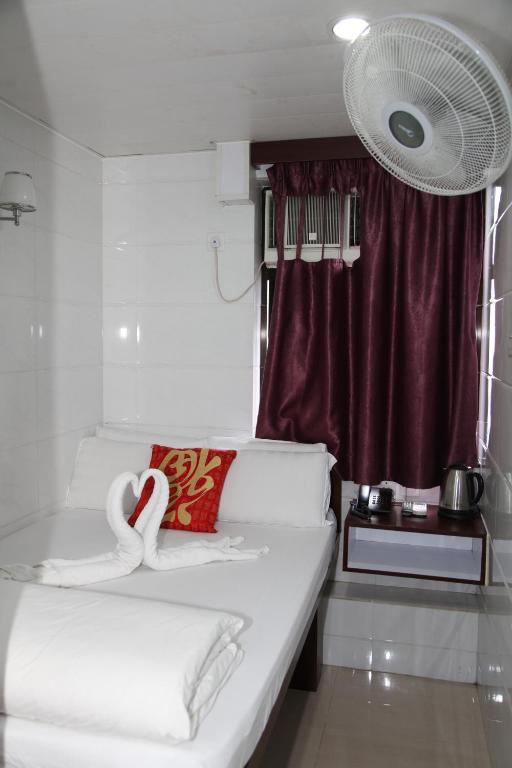 Postel nebo postele na pokoji v ubytování Pay-Less Guesthouse (7/F A9)