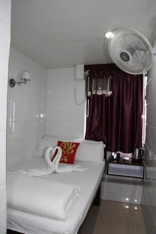 Postel nebo postele na pokoji v ubytování Pay-Less Guesthouse (7/F A9)