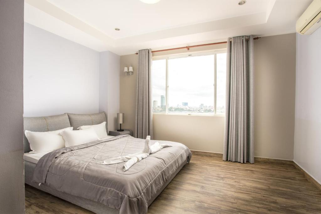 Postel nebo postele na pokoji v ubytování MekongView 1 CondoTel