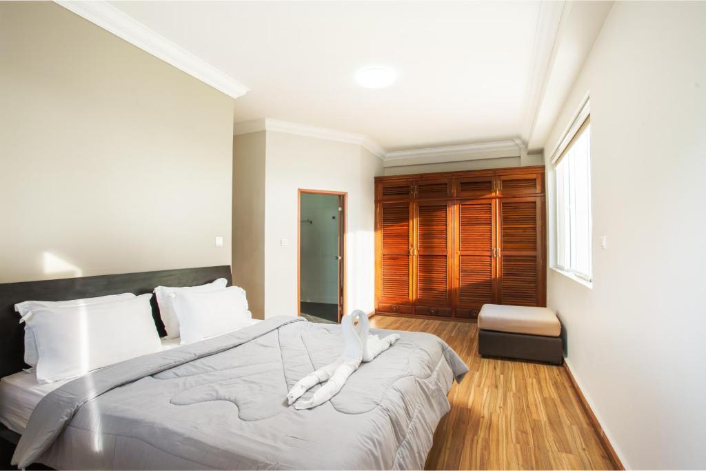 Postel nebo postele na pokoji v ubytování MekongView 1 CondoTel