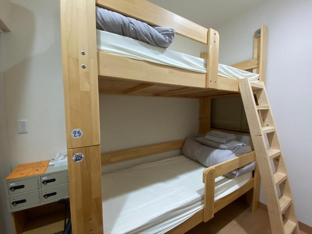 Postel nebo postele na pokoji v ubytování Upper Hotel Ryogoku