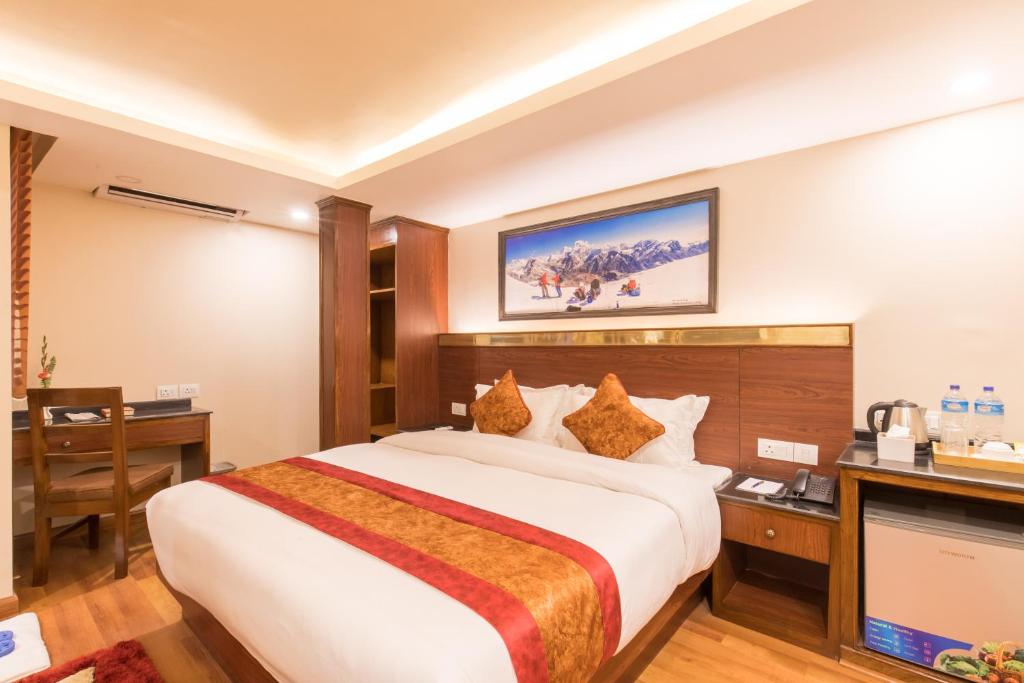 A bed or beds in a room at Thamel Boutique Hotel