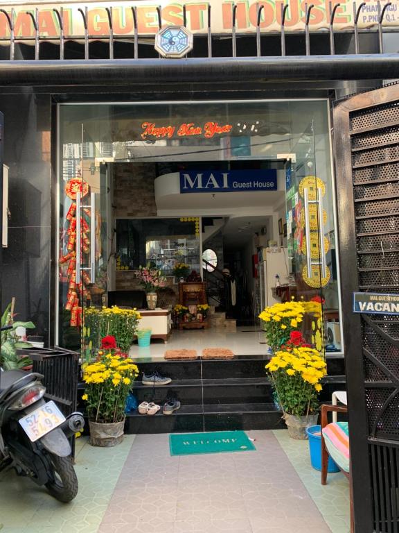 a store front of a mall with flowers in it at Mai Guest House in Ho Chi Minh City