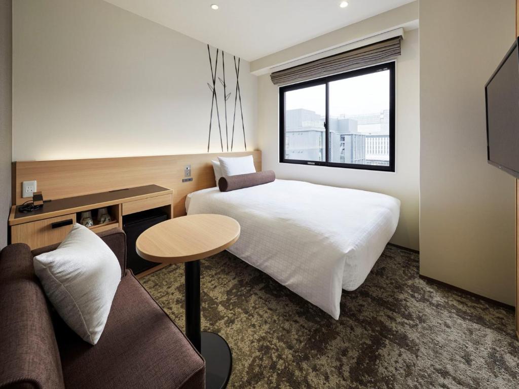 TV a/nebo společenská místnost v ubytování Royal Twin Hotel Kyoto Hachijoguchi