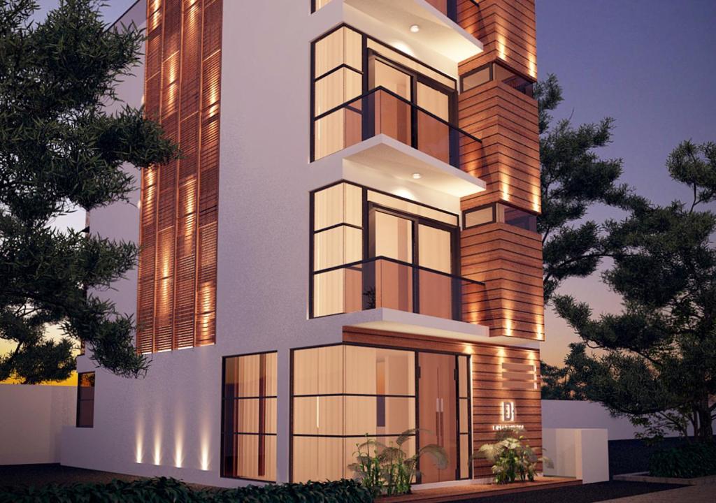 a rendering of a building with lights on at Dreams Grand in Hulhumale