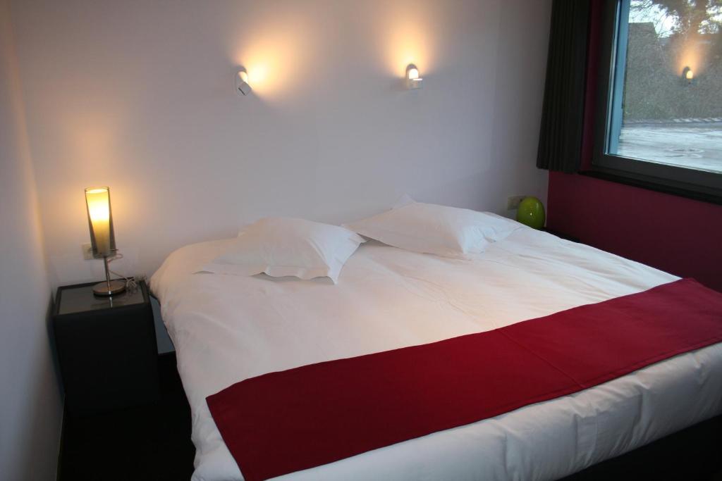 Ένα ή περισσότερα κρεβάτια σε δωμάτιο στο Hotel Carpinus