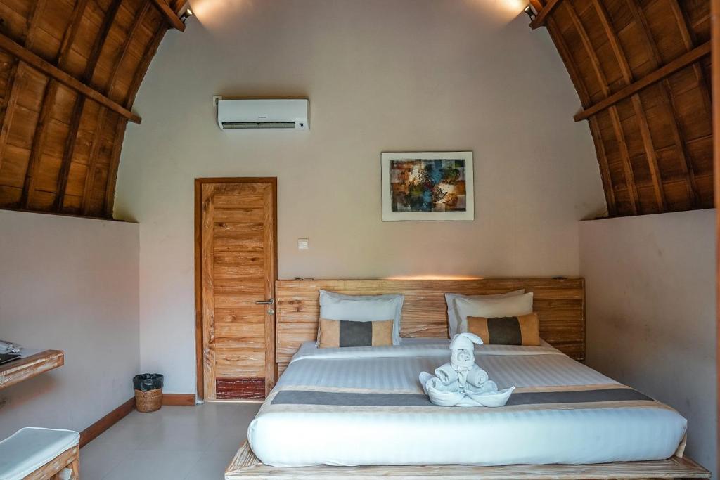 מיטה או מיטות בחדר ב-Uma Mani Villa Bali