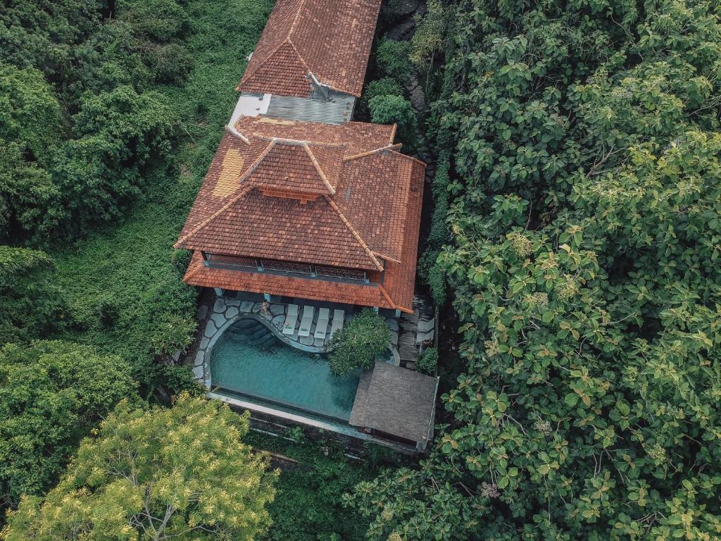 an overhead view of a house with a roof at Villa Beji Mawang Ubud by GenuineHost in Ubud