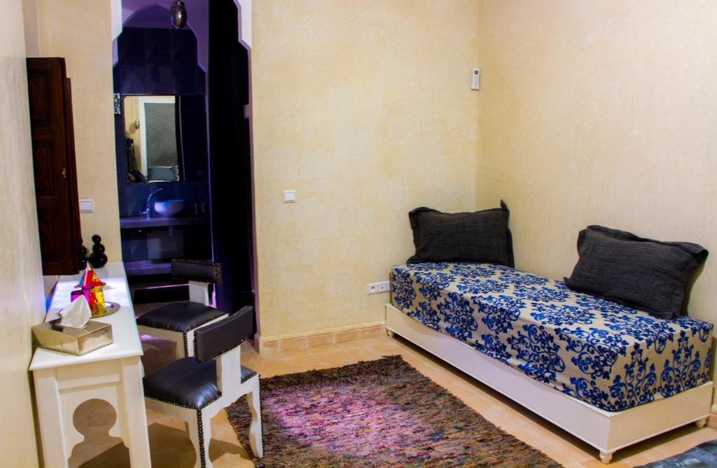 Postel nebo postele na pokoji v ubytování Riad El Walida