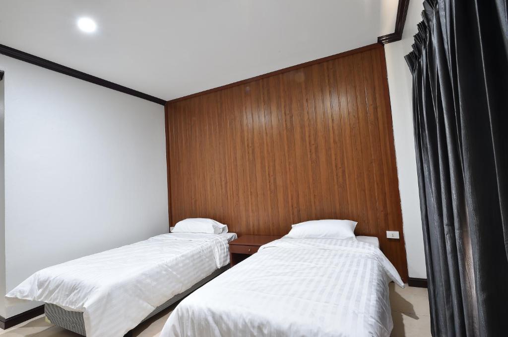Postel nebo postele na pokoji v ubytování AT TP HOTEL