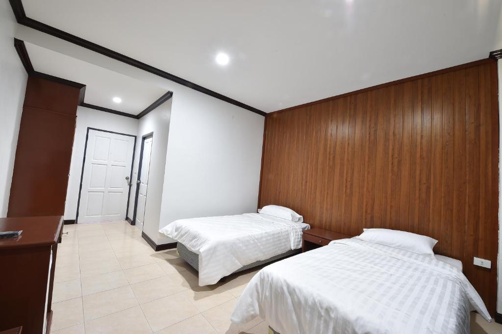 Postel nebo postele na pokoji v ubytování AT TP HOTEL