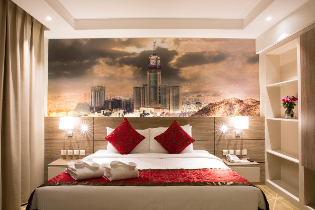 Postel nebo postele na pokoji v ubytování Hibatullah Hotel Makkah