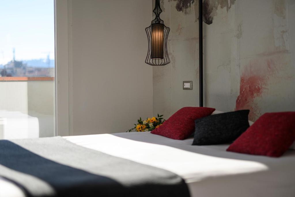 Posteľ alebo postele v izbe v ubytovaní B&B The Attico