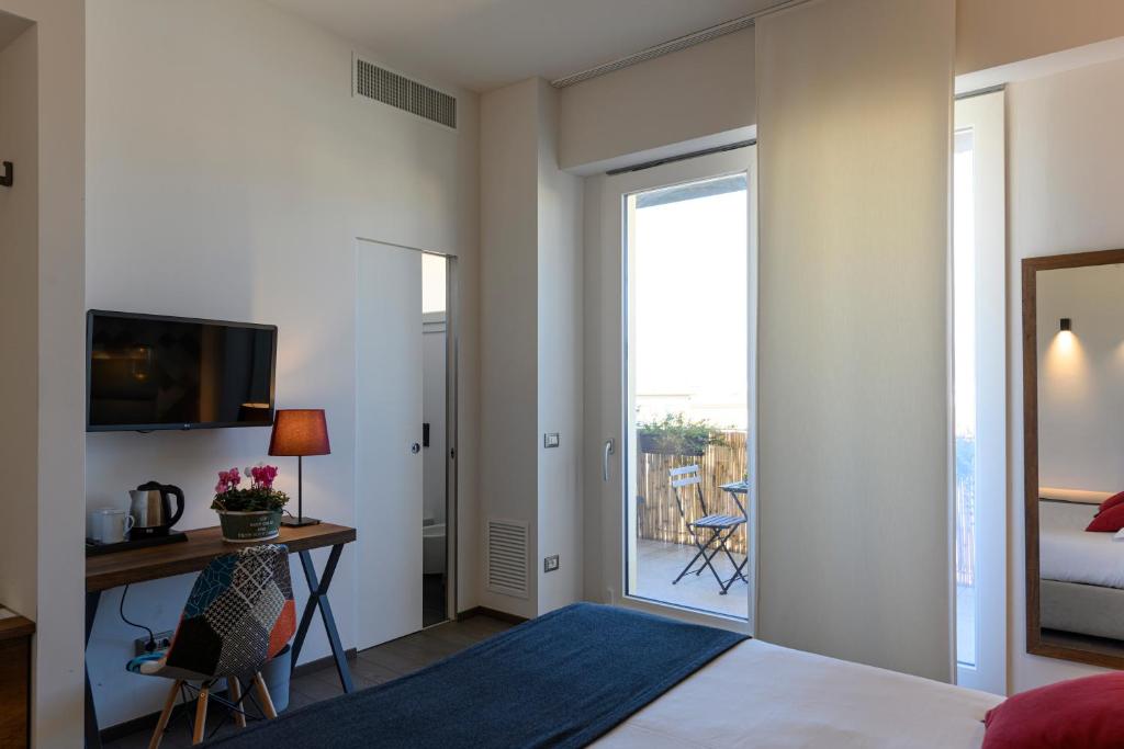 Posteľ alebo postele v izbe v ubytovaní B&B The Attico