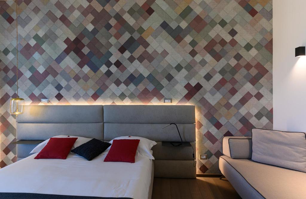 Posteľ alebo postele v izbe v ubytovaní B&B The Attico