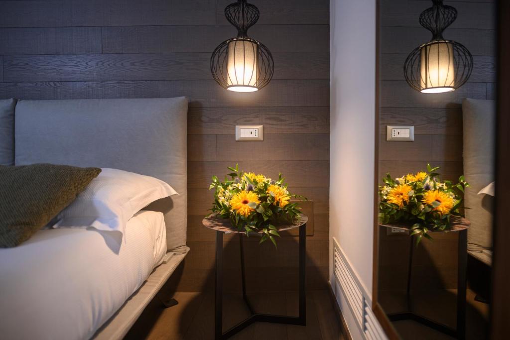 Posteľ alebo postele v izbe v ubytovaní B&B The Attico