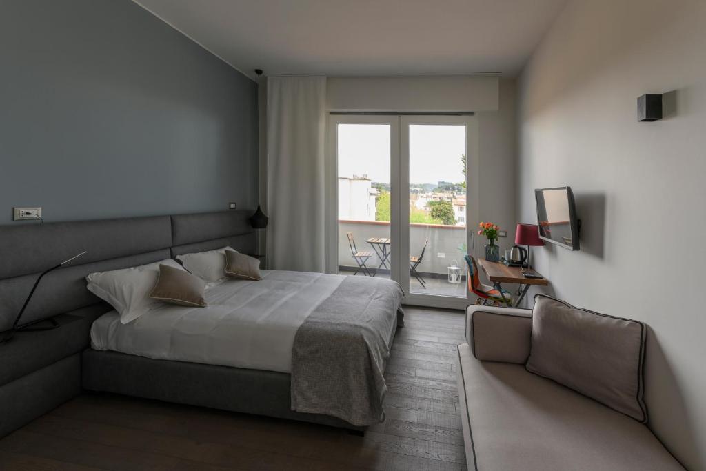 Posteľ alebo postele v izbe v ubytovaní B&B The Attico
