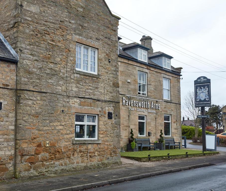 a brick building with a clock on the side of it at Ravensworth Arms by Chef & Brewer Collection in Gateshead