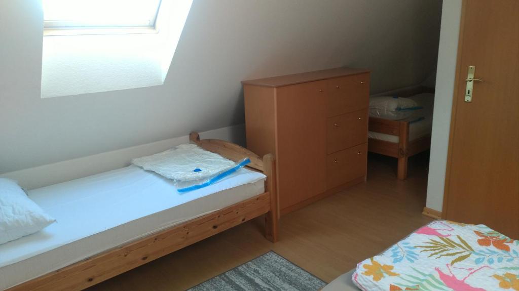 Postel nebo postele na pokoji v ubytování Ostseesonne