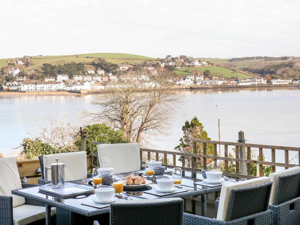 a table with food and a view of the water at The Light House in Bideford