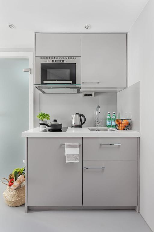 Kuchyň nebo kuchyňský kout v ubytování VISIONAPARTMENTS Lucerne - contactless check-in