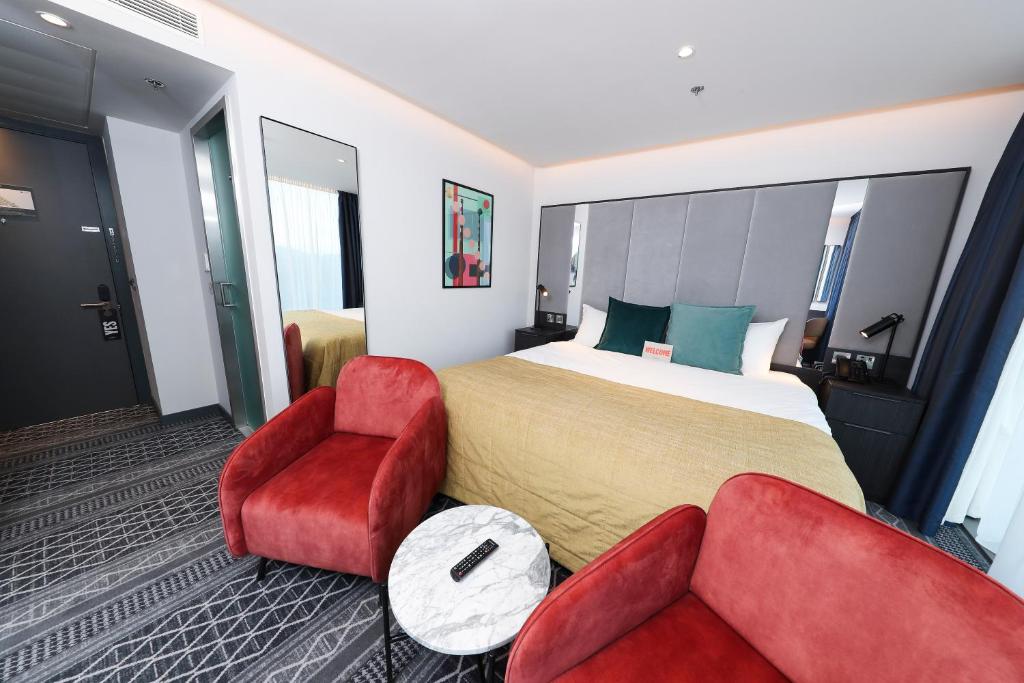 Llit o llits en una habitació de Marlin Hotel Stephens Green