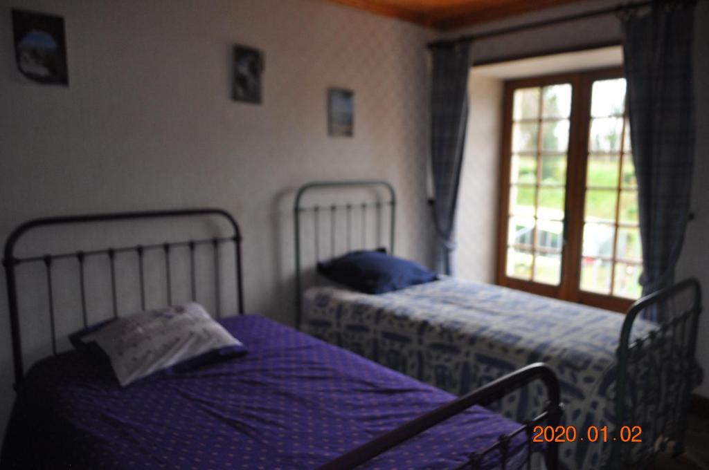 Postel nebo postele na pokoji v ubytování Ma maison bleue
