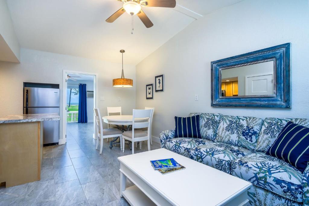 a living room with a couch and a table at Matecumbe Resort in Islamorada