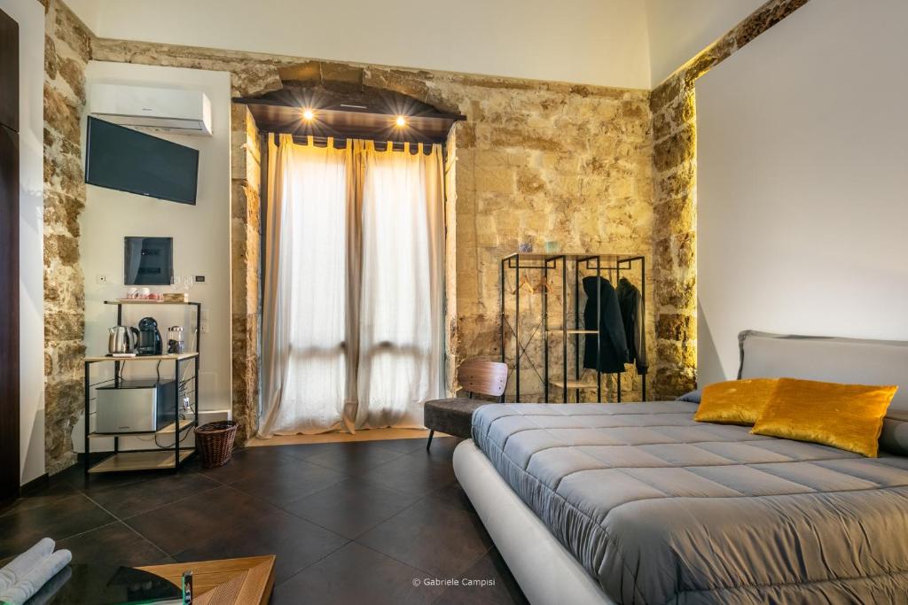 Postel nebo postele na pokoji v ubytování GARIBALDI MAISON DE CHARME