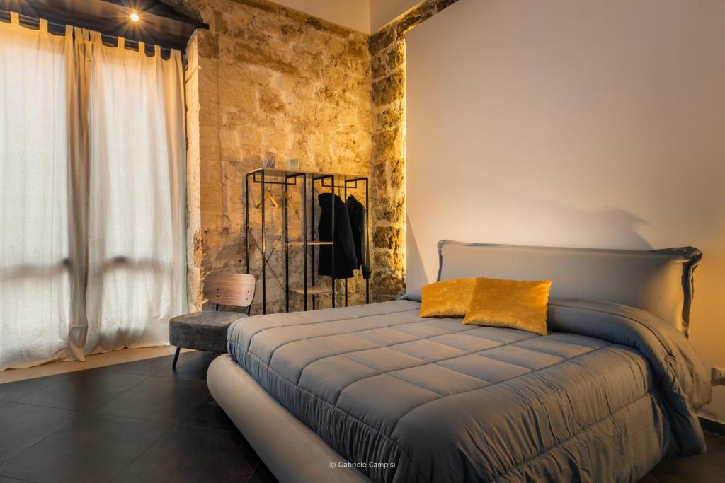 Postel nebo postele na pokoji v ubytování GARIBALDI MAISON DE CHARME