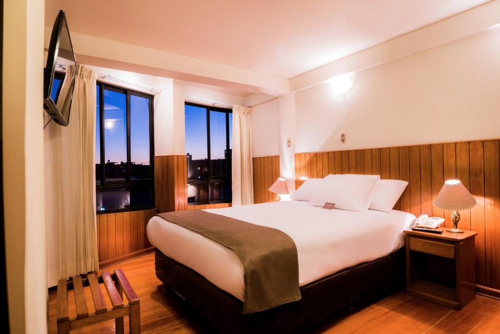 a hotel room with a bed and a window at DM Hoteles Arequipa in Arequipa