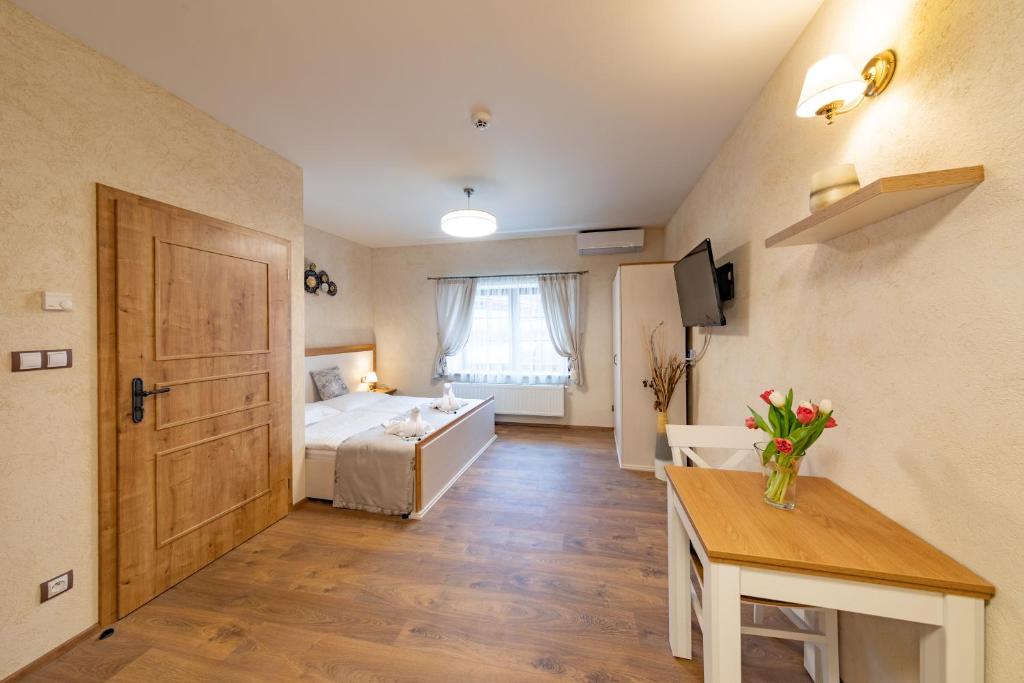 Postel nebo postele na pokoji v ubytování Residence Terčino Údolí