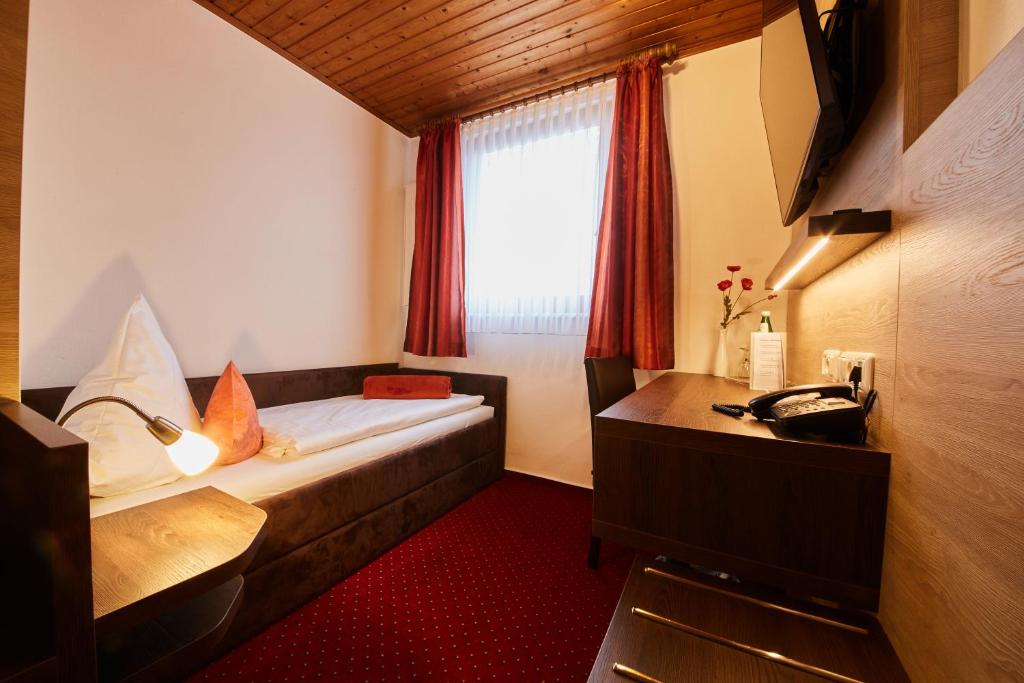 Postel nebo postele na pokoji v ubytování Hotel Schoos