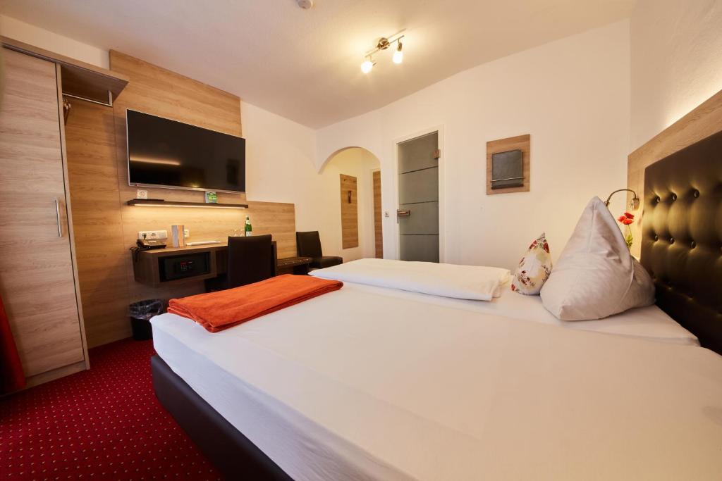 Postel nebo postele na pokoji v ubytování Hotel Schoos