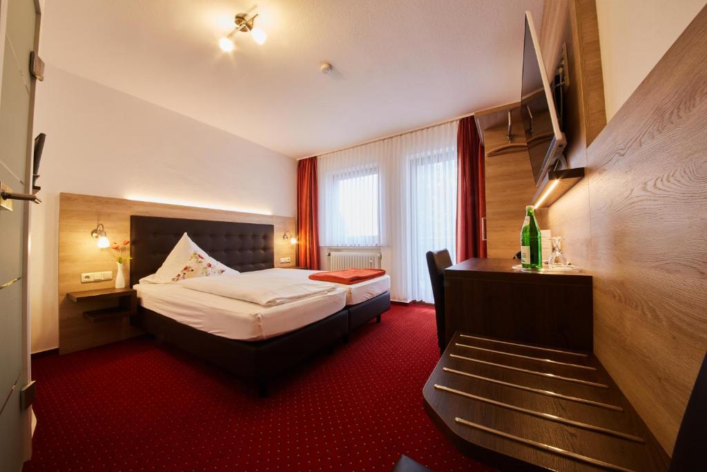 Postel nebo postele na pokoji v ubytování Hotel Schoos