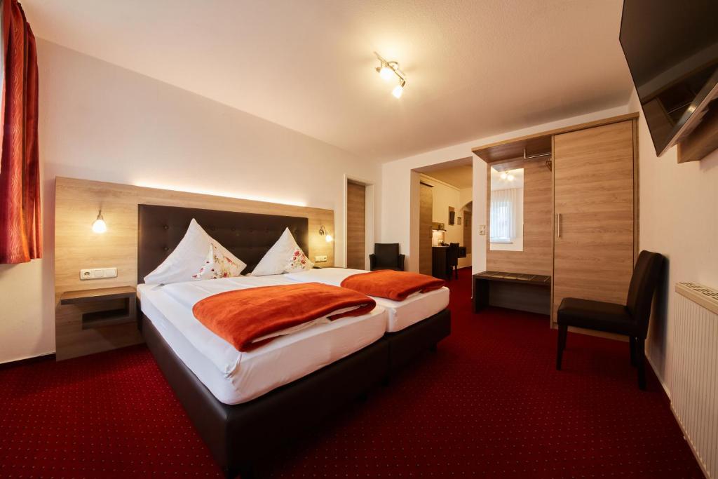 Postel nebo postele na pokoji v ubytování Hotel Schoos