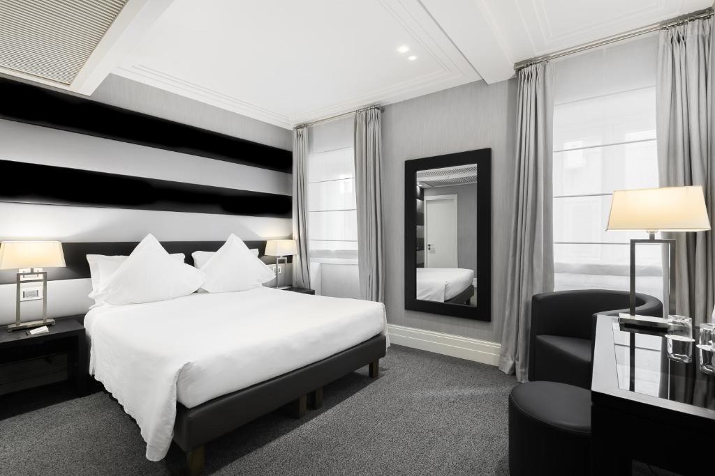 Postel nebo postele na pokoji v ubytování Hotel Mancino 12