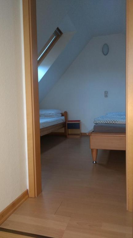 Postel nebo postele na pokoji v ubytování Ostseesonne
