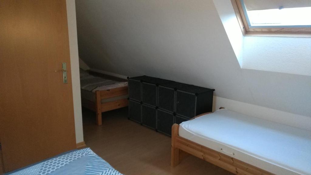 Postel nebo postele na pokoji v ubytování Ostseesonne