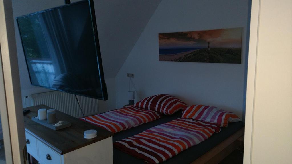 Postel nebo postele na pokoji v ubytování Ostseesonne