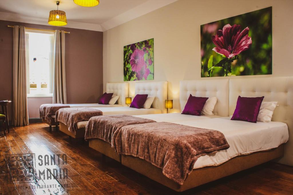 Postel nebo postele na pokoji v ubytování Santa Maria Hostel