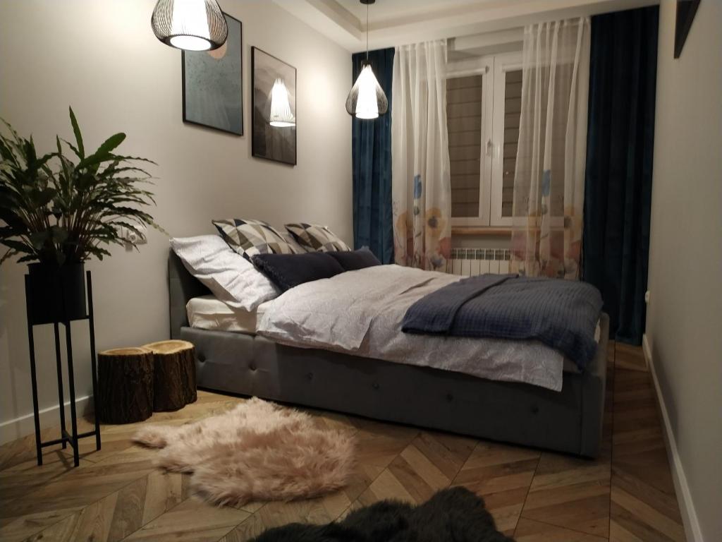 Posteľ alebo postele v izbe v ubytovaní Apartament Skrytka
