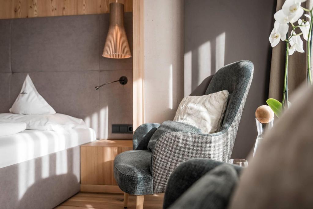 Postel nebo postele na pokoji v ubytování Alpenheim Charming & Spa Hotel