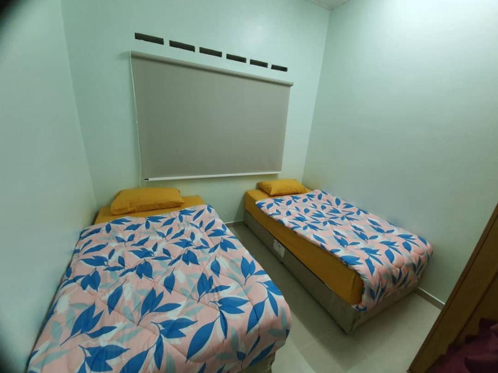 Postel nebo postele na pokoji v ubytování Hotel ali Imran