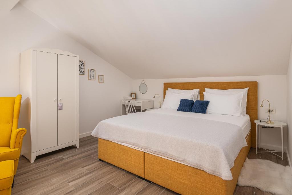 Posteľ alebo postele v izbe v ubytovaní Apartments Villa Maria